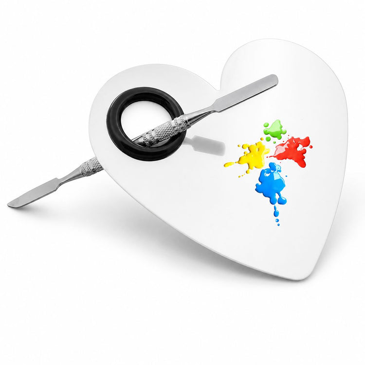 Heart-shaped stainless steel nail art mixing palette with spatula tool for blending gel colours and salon nail art designs