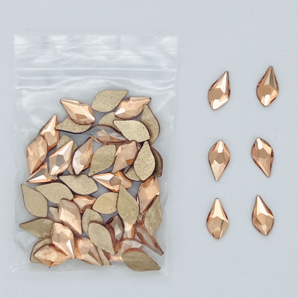 leaf-shaped nail art rhinestones — faceted flatbacks in zip bag with loose samples (NSI Australia)