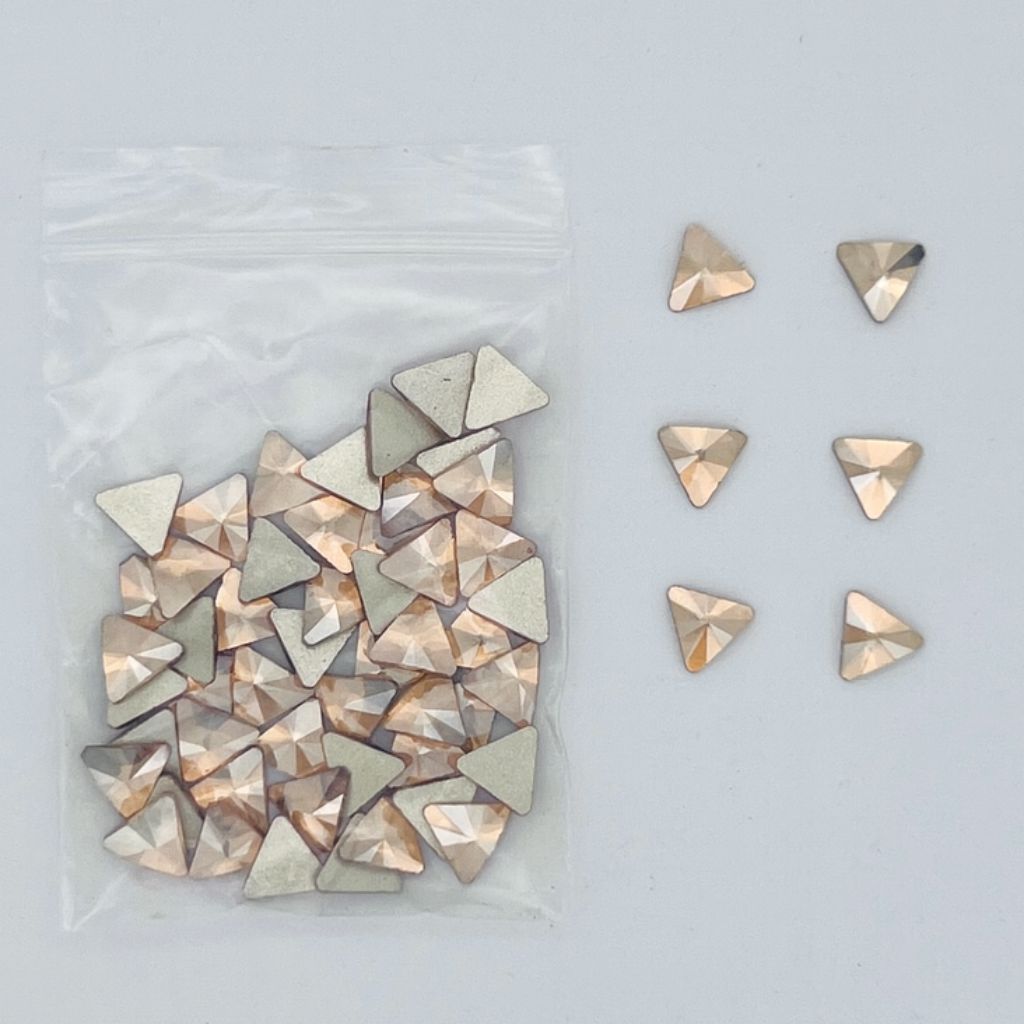 Gold triangle nail art rhinestones — faceted flatbacks in zip bag with loose samples (NSI Australia)