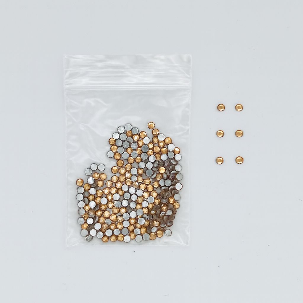 Gold round nail art rhinestones — 2.1 mm (R17) — zip bag with loose sample pieces