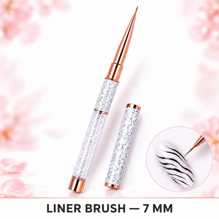 7 mm liner nail art brush with crystal-filled handle and matching cap, shown painting black wavy stripes on a white nail.
