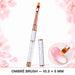 Ombré 10.5 × 5 mm nail art brush with crystal-filled handle and matching cap, shown blending pink and white on a nail.
