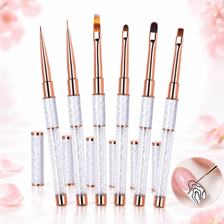 Six nail art brushes with liner, ombré, oval and square tips, crystal-filled handles, rose gold ferrules and matching caps.