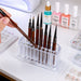 Clear Acrylic Nail Art Brush and Tool Holder stand with nail brushes, polish bottles and rhinestone accessories