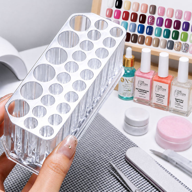 Clear Acrylic Nail Art Brush and Tool Holder with multi-size slots displayed with nail polish, files and salon accessories