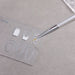 Clear nail art design palette with nail shape guides and detail brush painting white gel nail artwork