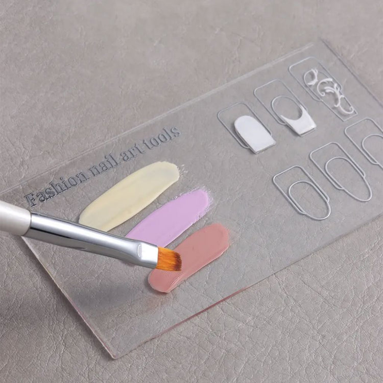 Clear nail art design palette with nail shape guides, pastel gel polish swatches and brush for colour mixing
