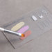 Clear nail art design palette with nail shape guides, pastel gel polish swatches and brush for colour mixing