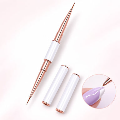 White and rose gold double-ended nail art liner brush with two protective caps, shown painting a white curved line on a purple nail.
