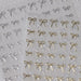 Gold and silver bow nail art stickers pack with delicate metallic ribbon designs for elegant salon manicure decorations