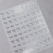 Silver bow nail art stickers sheet with delicate metallic ribbon designs for elegant salon manicure decorations