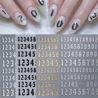 Old English number nail art sticker sheets in white, black and gold with example almond-shaped nails featuring black number decals