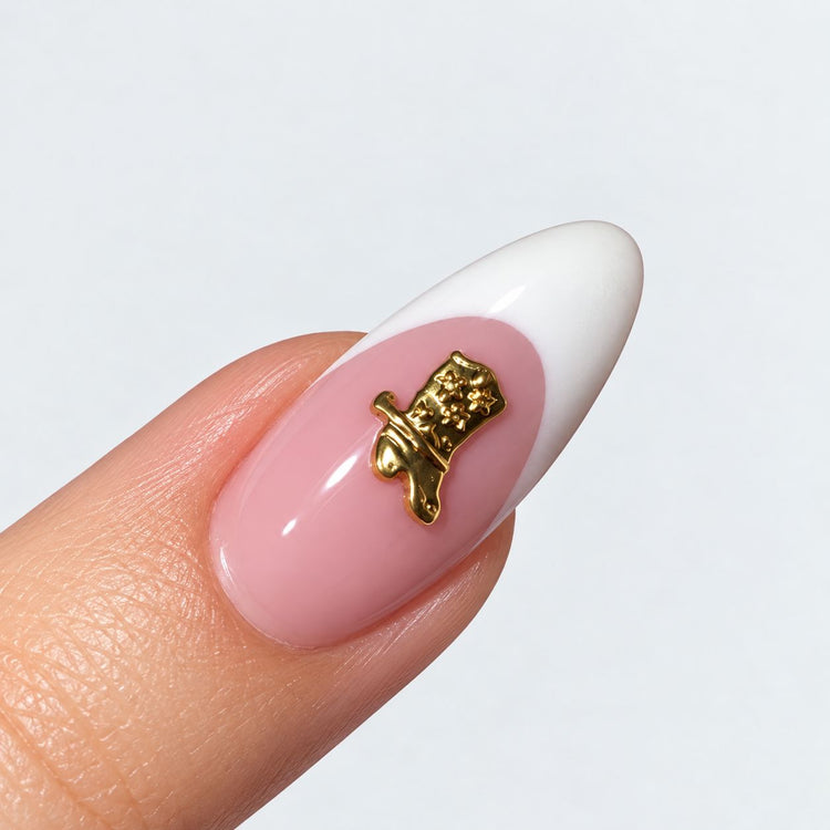 Gold plated boot nail charm on a pink and white French almond nail, NSI Australia