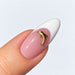 Gold plated dolphin nail charm on a pink and white French almond nail, NSI Australia