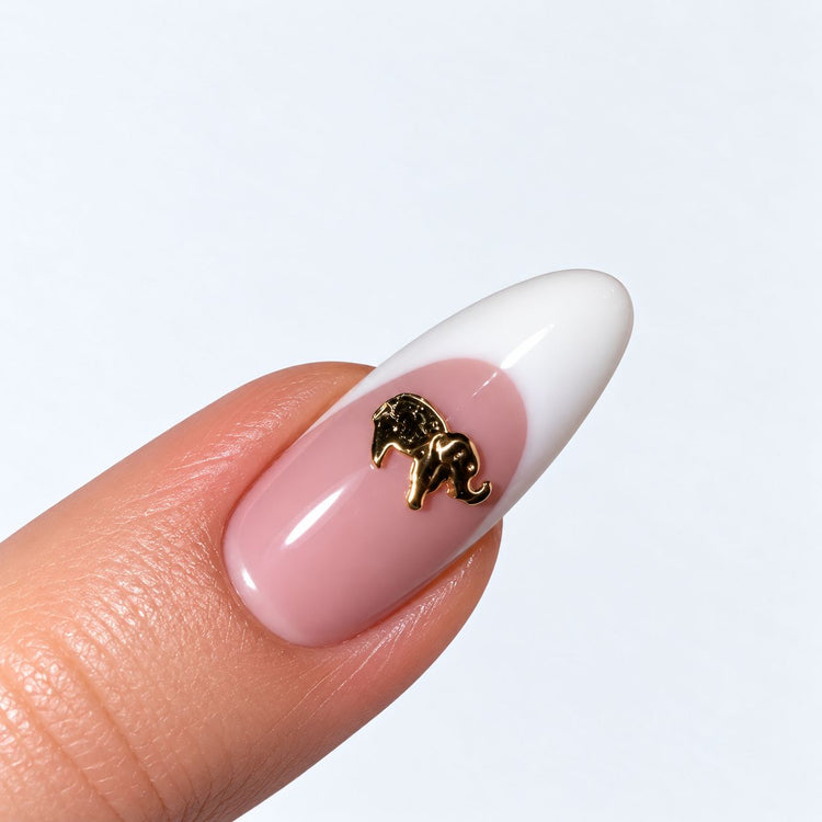 Gold plated elephant nail charm on a pink and white French almond nail, NSI Australia