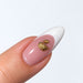 Gold plated swan nail charm on a pink and white French almond nail, NSI Australia