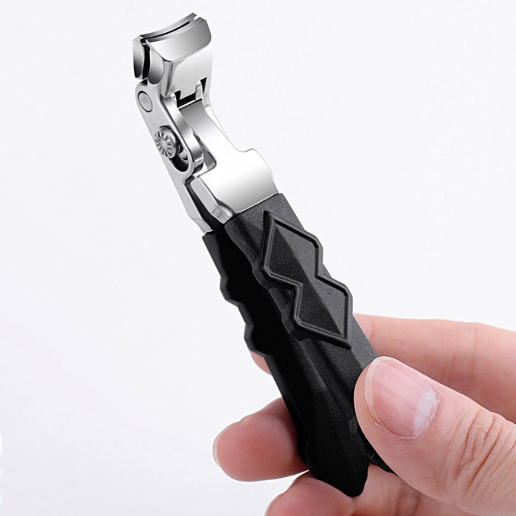 Wide-jaw nail clipper with anti-slip black handle — stainless steel, shown in hand (NSI Australia)