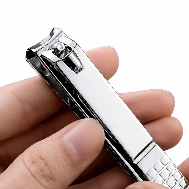 Silver large curved blade nail clipper held in hand showing smooth lever design and textured grip, NSI Australia