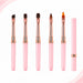 Set of five pink gel nail brushes with rose gold ferrules and assorted tip shapes, shown alongside a capped brush.
