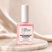 Nail Success Australia nail strengthener and growth treatment bottle on marble display with pink formula, white cap and nail ridge filler label