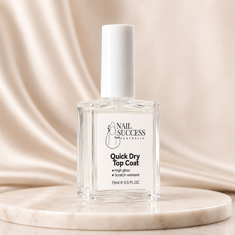 Nail Success Australia quick dry top coat bottle on marble display with white cap, clear formula, high gloss and scratch-resistant finish