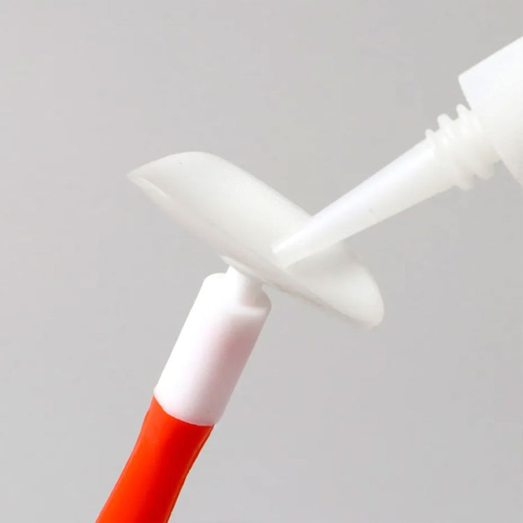 Nail suction cup stick holding a false nail tip for easy gel polish application, nail art practice and professional manicure display work