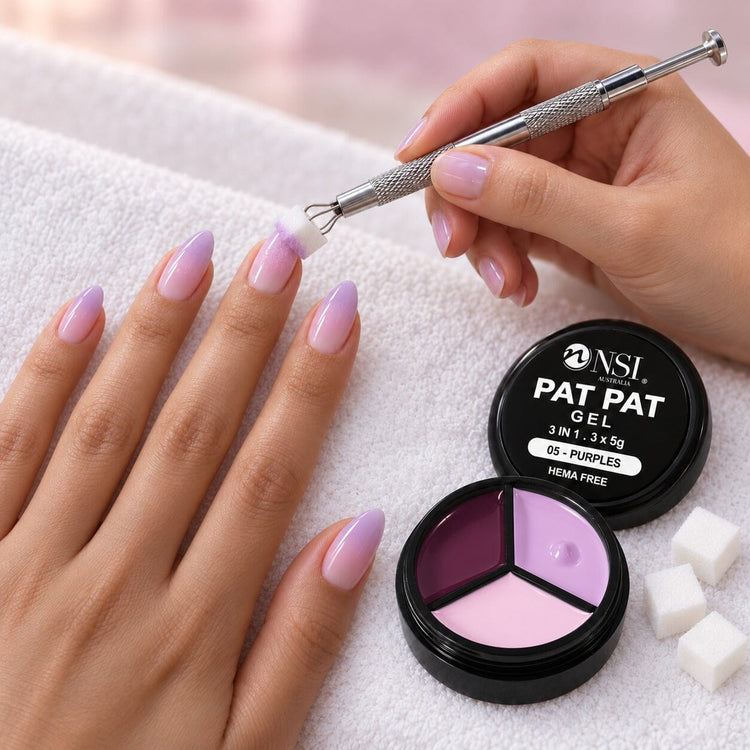 Nail tech using the 3 Colour - 05 Purples Pat Pat Gel kit, patting purple ombre onto a client's nails with a cube sponge in the claw tool