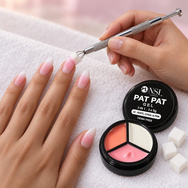 Nail tech using the 3 Colour - 10 White, Coral & Pink Pat Pat Gel kit, patting pink and white ombre onto a client's nails with a cube sponge in the claw tool