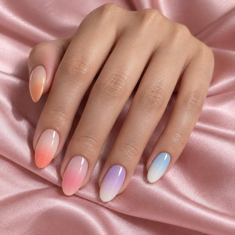 Almond nails with soft sponge ombre fades in peach, coral, pink, lilac and baby blue