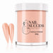Coral pink acrylic nail powder in a 445 g tub with two matching stiletto nail swatches – Nail Success Australia