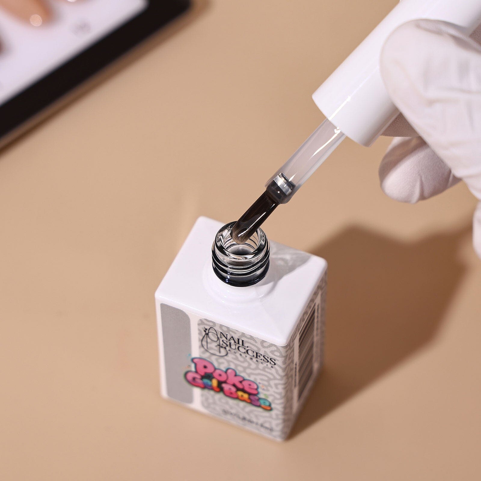 Nail Success Australia Poke Gel Base — clear 3D nail art base gel with brush applicator held by a gloved hand
