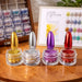 Premium chrome powder nail kit display with mirror-finish nail samples and chrome pigment jars in gold, silver, purple and red