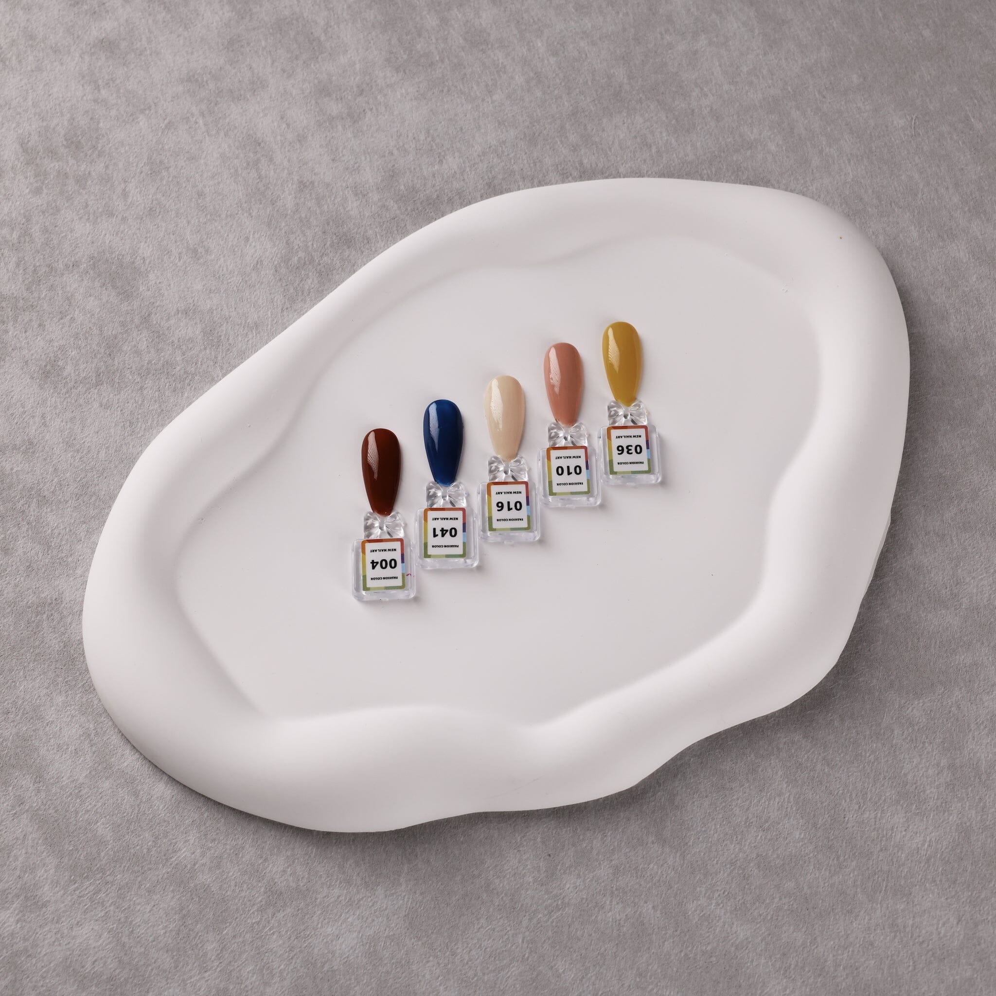 NSI Australia Pro Magnetic swatch tips — five numbered gel polish sample nails on white tray (004, 041, 010, 016, 036)