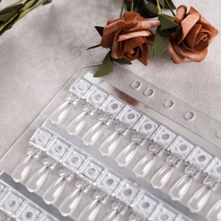 NSI Australia Pro Magnetic Swatch Book refill page — close-up of clear teardrop gel polish swatch tips on magnetic bases with roses