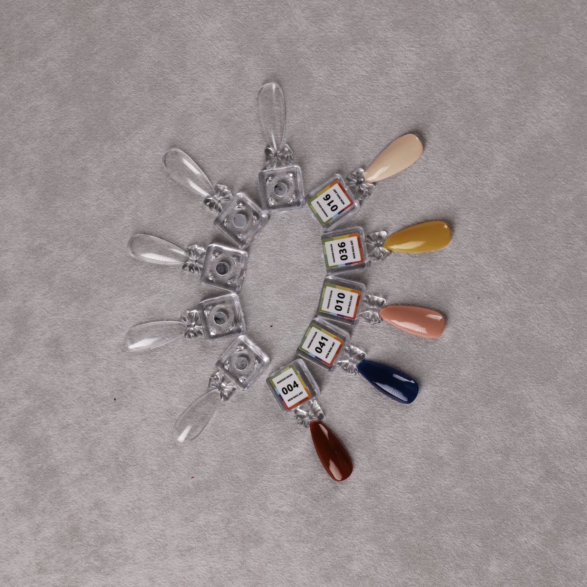 Magnetic gel polish swatch tips for NSI Australia display book — fanned clear and coloured sample nails with numbered labels