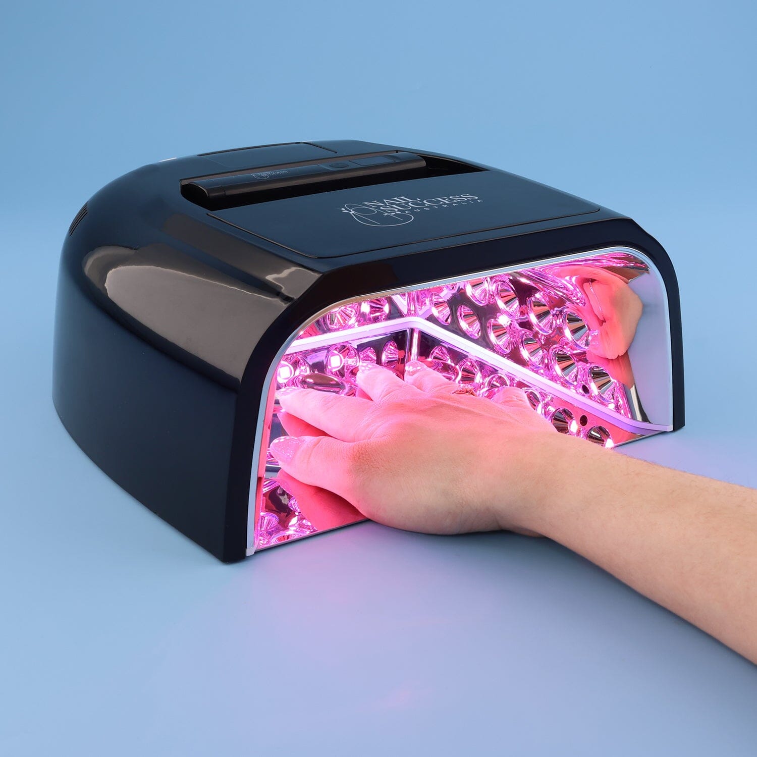 UV nail lamp in black, hand curing gel nails under LED lights