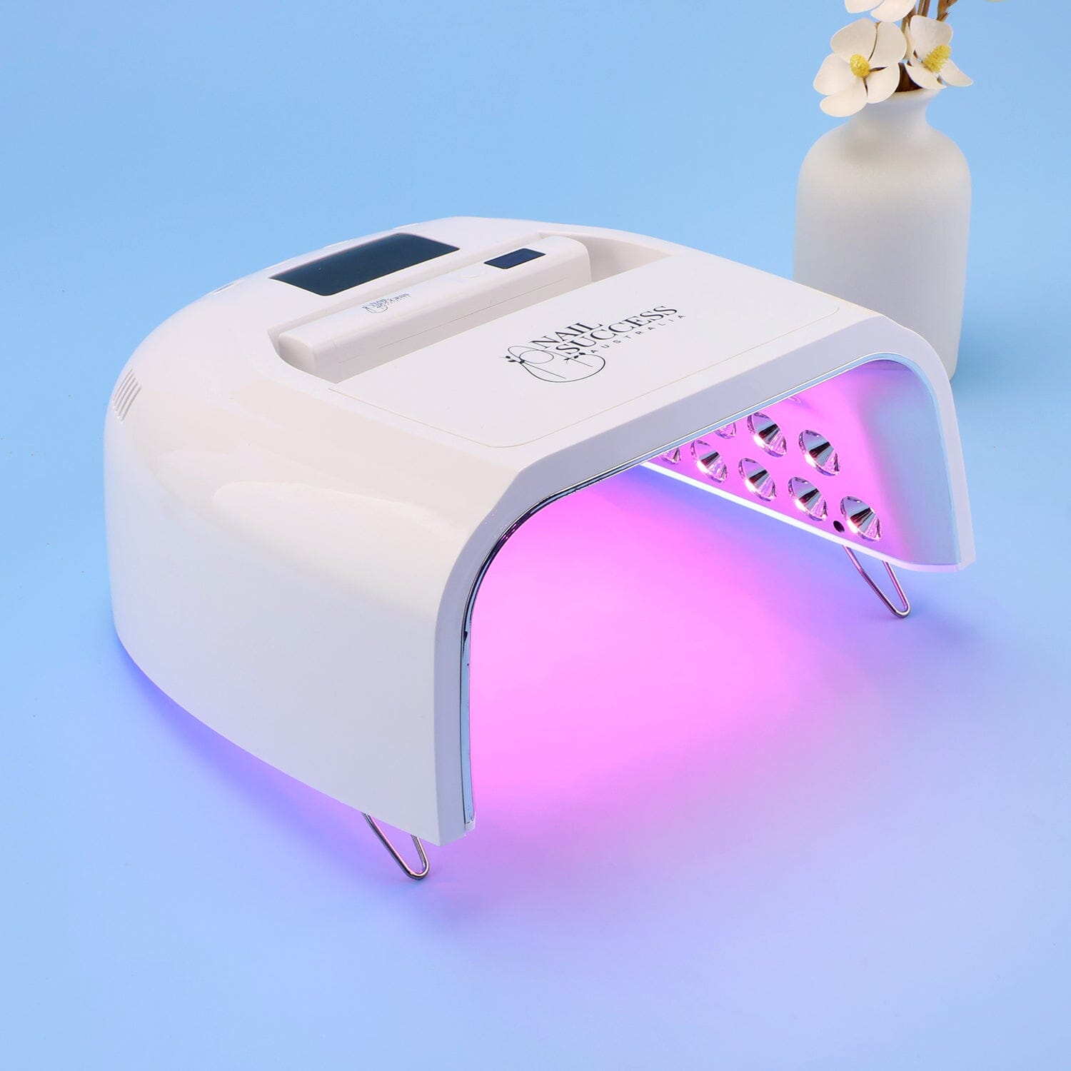 UV nail lamp with built-in flash cure torch for professional gel nails.