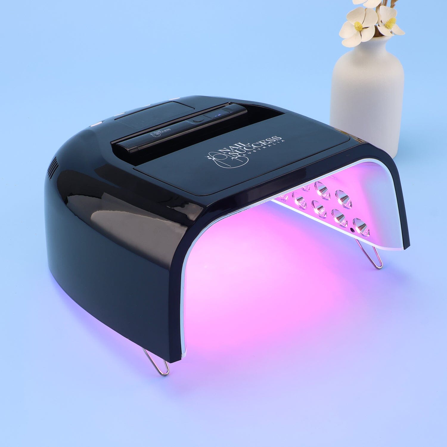 UV nail lamp with built-in flash cure torch for curing gel polish and builder gels.