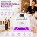 A white professional nail lamp machine with purple LED light glowing underneath, shown in a salon setting with a woman working in the background. The image includes promotional text and icons for 'Nail Success Australia' and displays nail polish bottles and brushes on a counter.