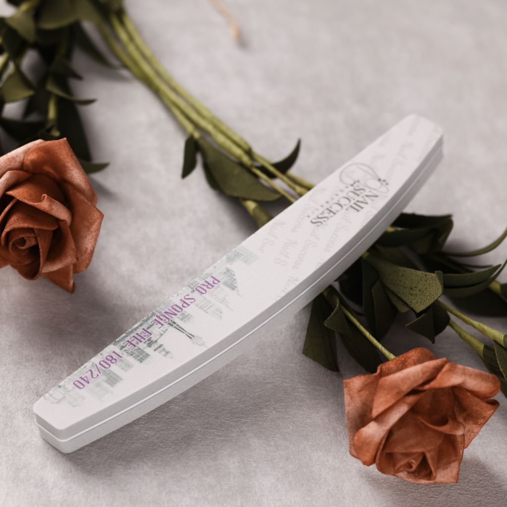 240 grit—curved foam buffer with skyline print, styled with roses on grey