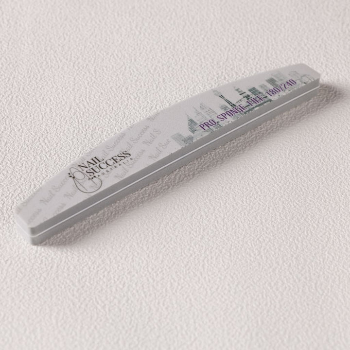 Nail Success Australia Pro Sponge File 180/240 grit—curved foam buffer emery board with skyline print on white background