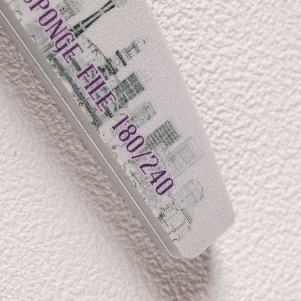 240—macro close-up of foam buffer with skyline print and purple grit marking