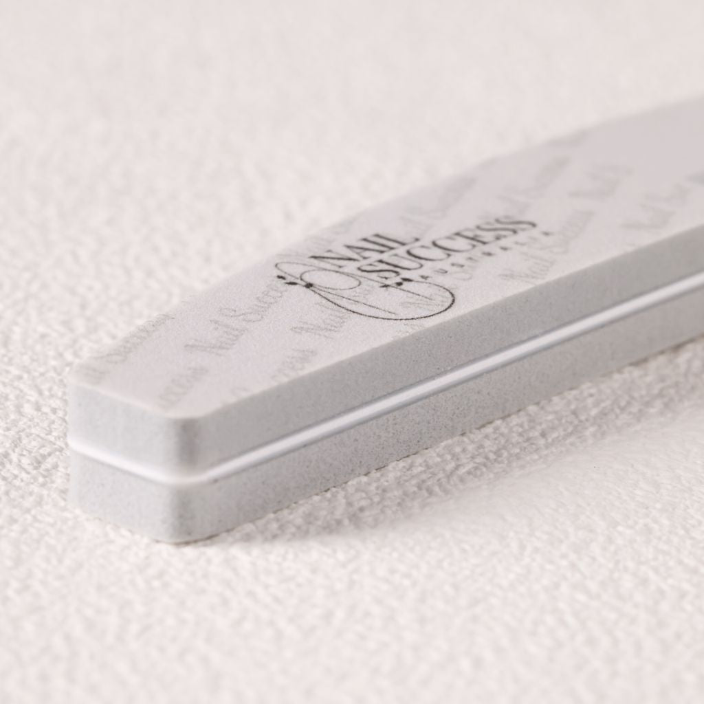 240 grit—close-up of soft foam buffer emery board with logo on white