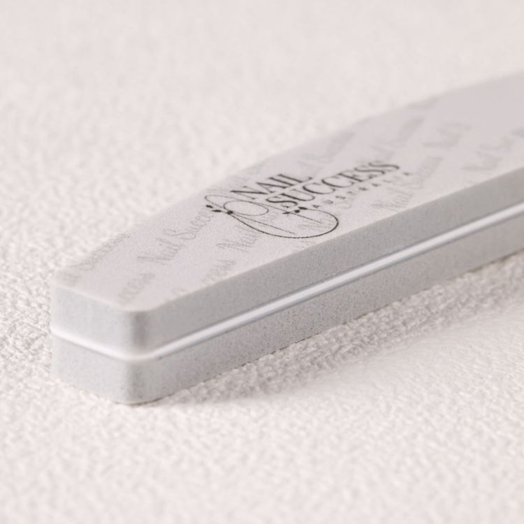 240 grit—close-up of soft foam buffer emery board with logo on white
