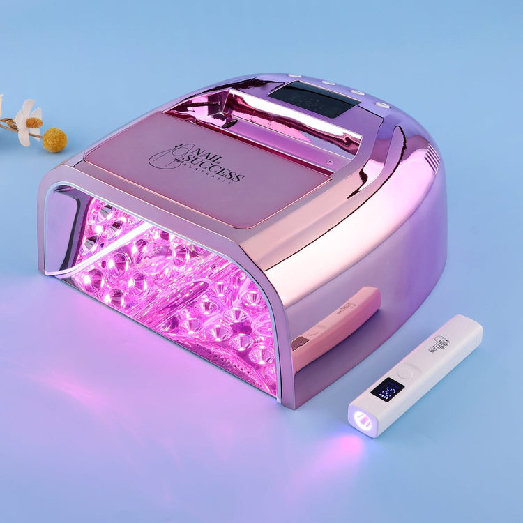 Rose Gold NSI Australia Rechargeable LED UV Nail Lamp with handheld flash torch on blue background