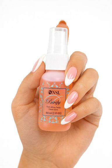 Hand holding NSI Australia Purify—fast-acting antiseptic nail prep spray, clean scent, 60 mL (2 fl oz) bottle