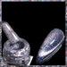 Reflective glitter cat eye magnetic gel polish in silver with sparkling holographic finish, shown on a nail tip and brush for shimmering nail art designs