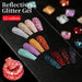 Born Pretty Reflective Glitter Gel Polish 12 colour swatches displayed on black palette with red glitter close-up, NSI Australia