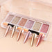 Six shade rose gold solid chrome pigment palette with applicators and matching chrome nail tip swatches