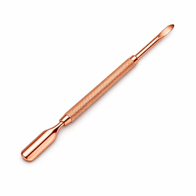 Rose gold double-ended cuticle pusher nail tool with rounded pusher tip, wide flat scraper end and textured grip handle